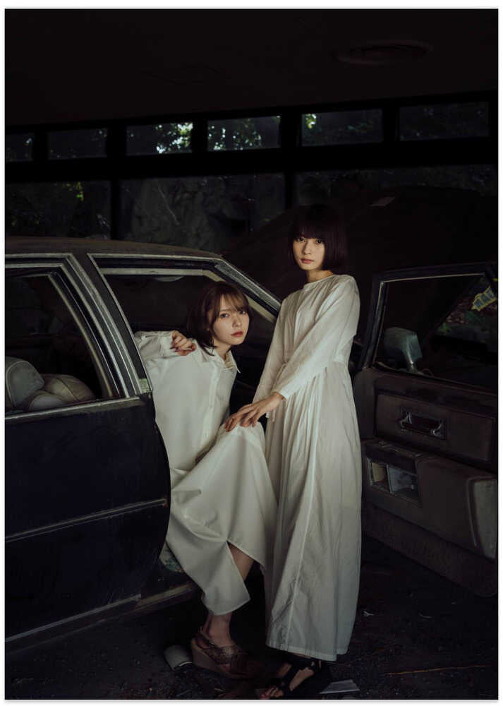 Two Women Vintage Car